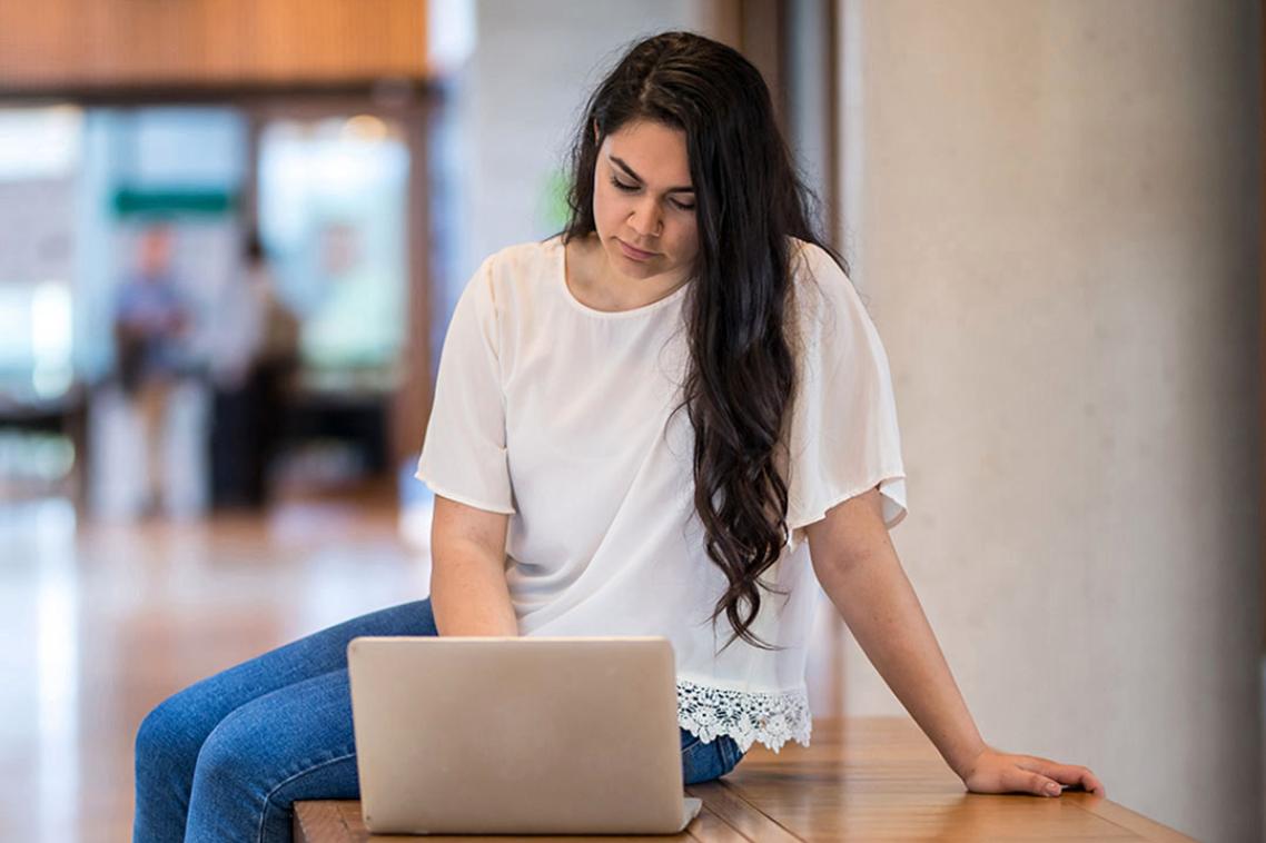 Student looking at laptop